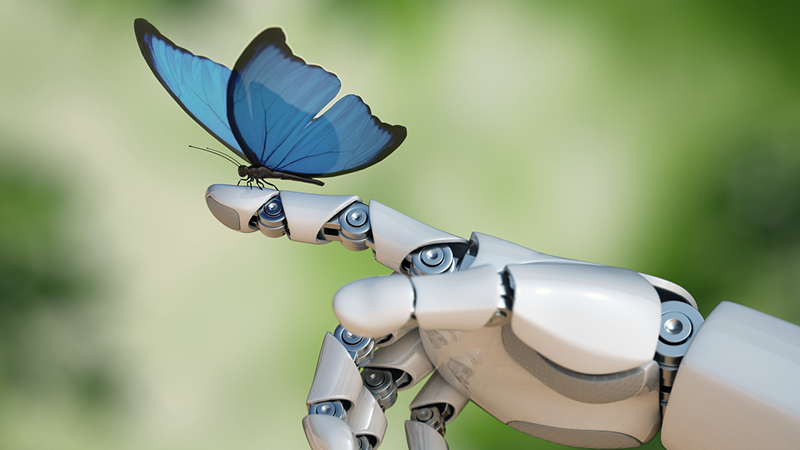 Bild som visar en robothand med en fjäril på fingret.